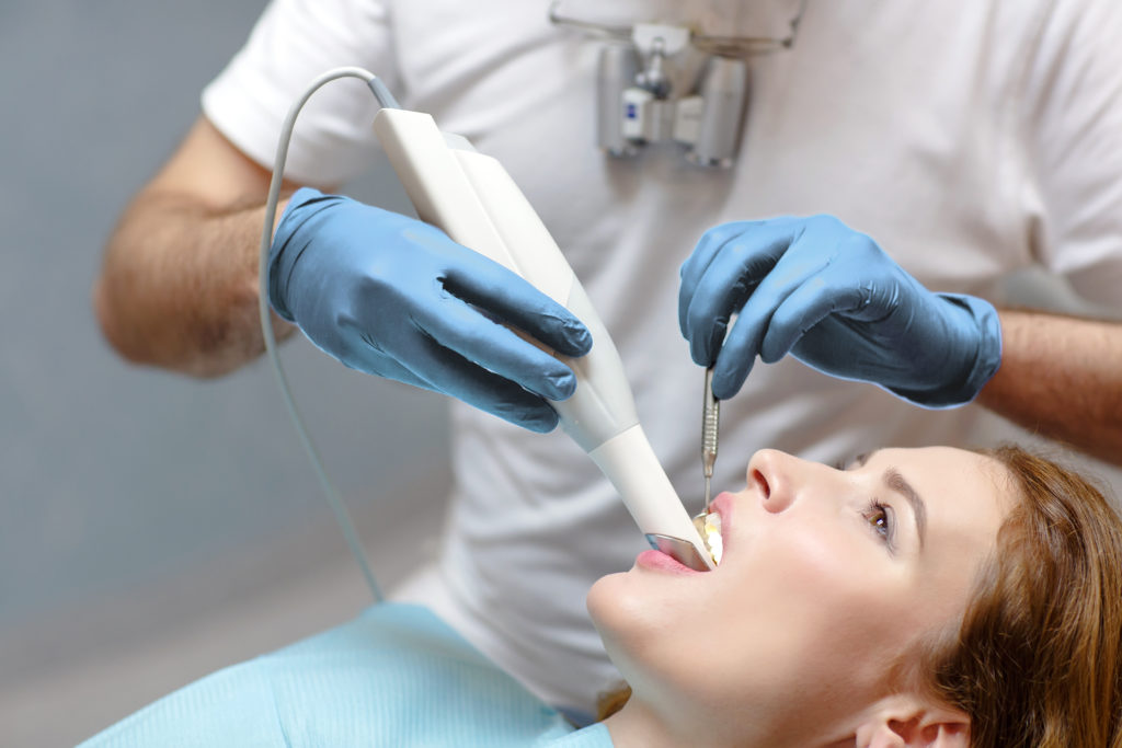 Dental patient with intraoral scan in mouth